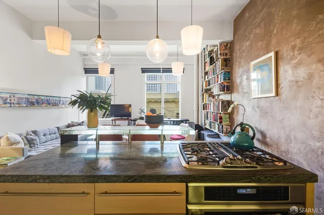 a kitchen with stove and cabinets