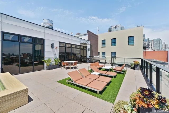 a outdoor space with patio the couches and a dining table with the potted plants