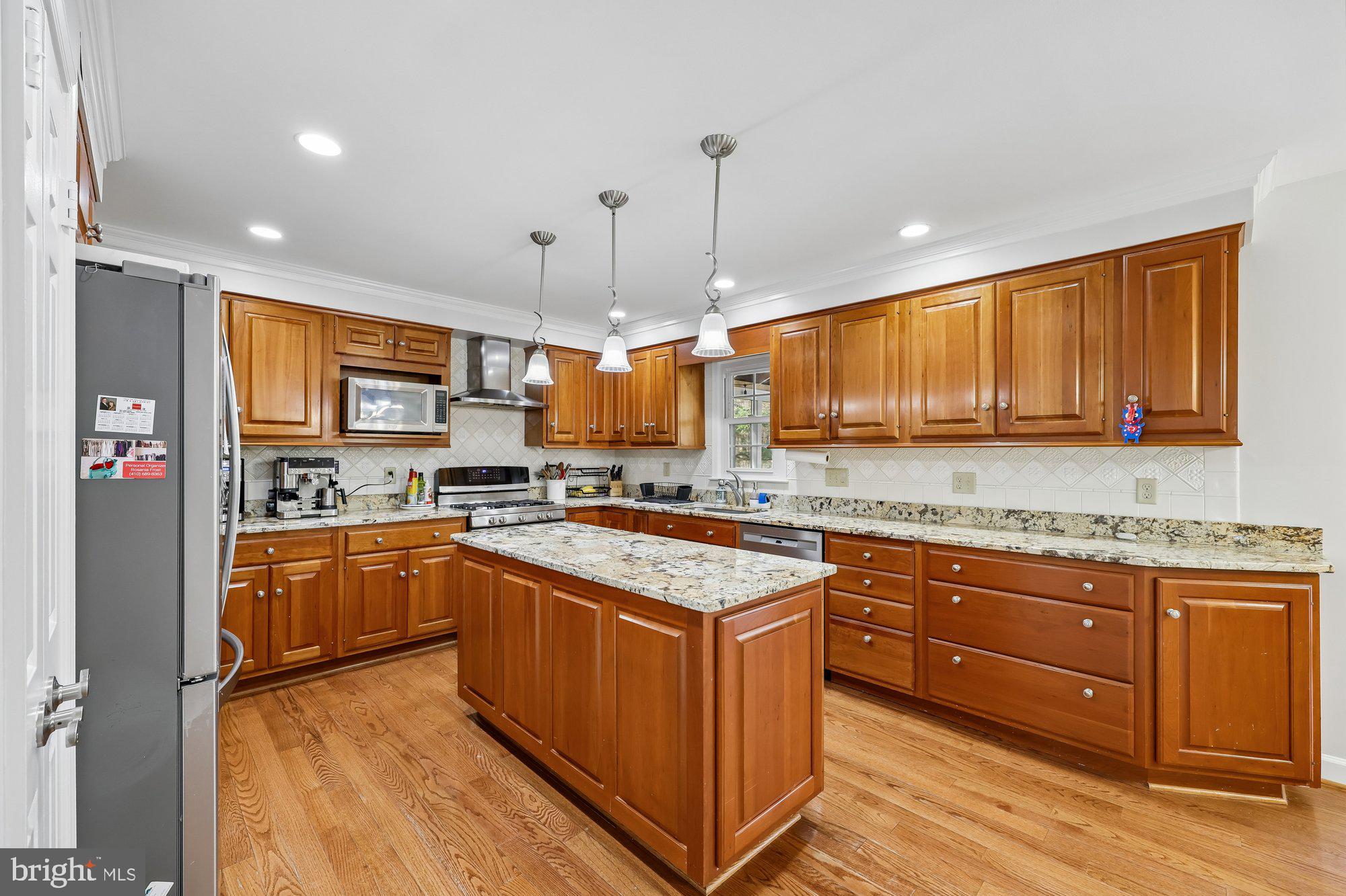 18 Kaywood Court Silver Spring, MD 20905 - Photo 21 of 71 a kitchen with stainless steel appliances granite countertop a stove a sink dishwasher and a refrigerator