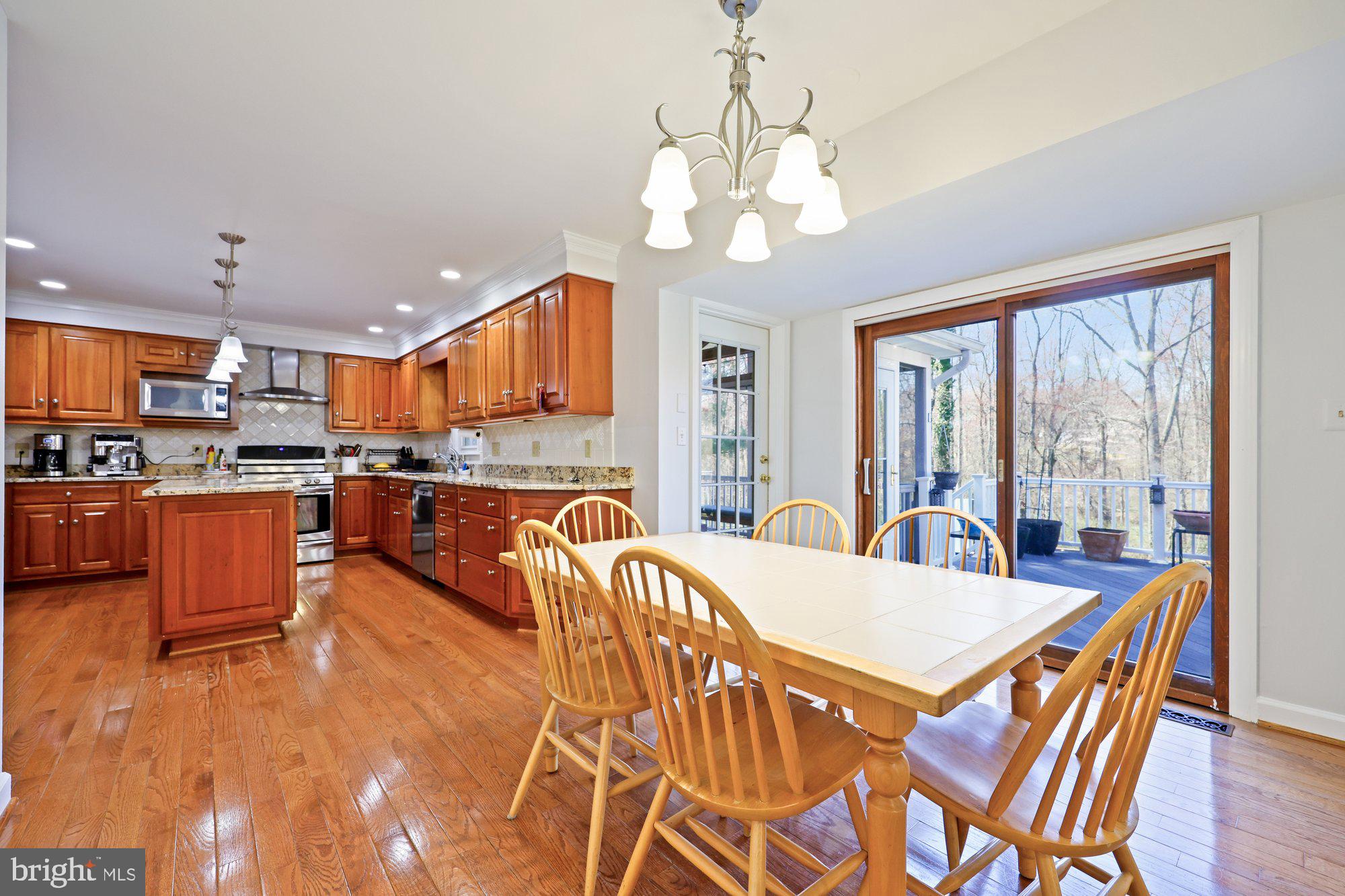 18 Kaywood Court Silver Spring, MD 20905 - Photo 25 of 71 a view of a dining room with furniture a chandelier and wooden floor