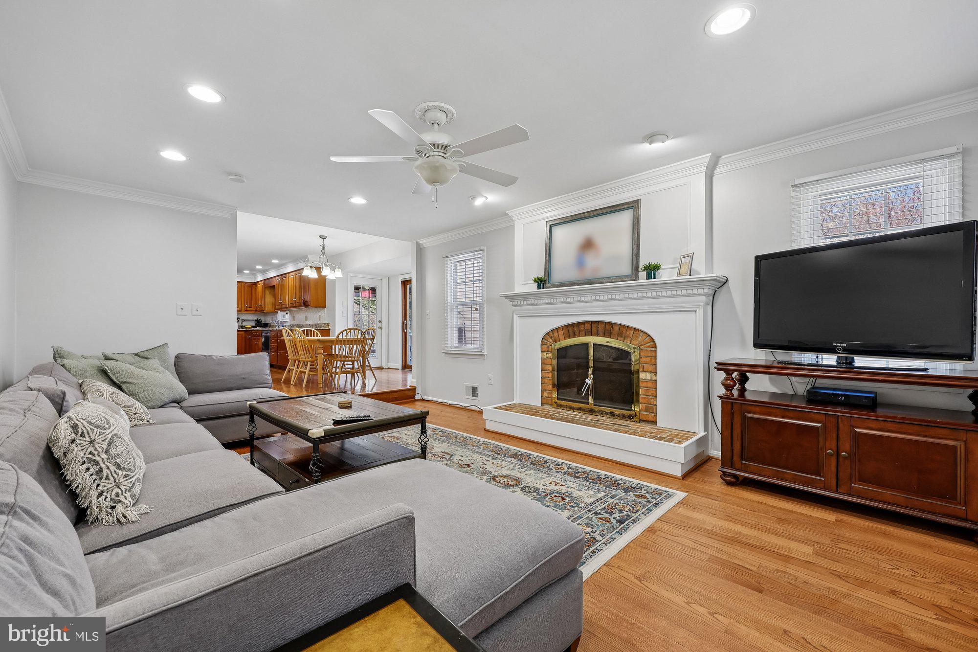 18 Kaywood Court Silver Spring, MD 20905 - Photo 26 of 71 a living room with furniture and a flat screen tv