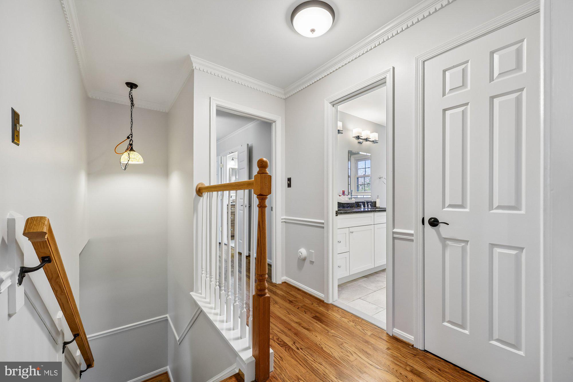 18 Kaywood Court Silver Spring, MD 20905 - Photo 38 of 71 a view of a hallway with wooden floor and staircase