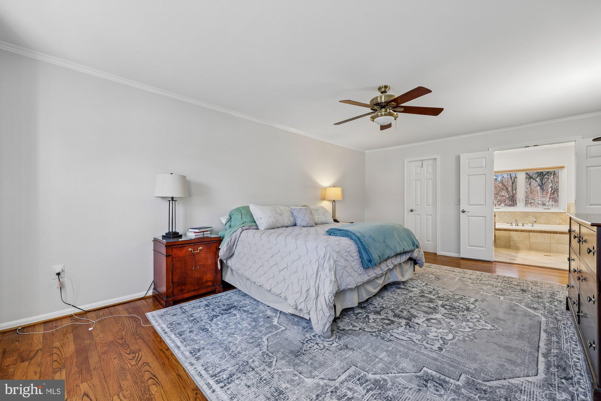 18 Kaywood Court Silver Spring, MD 20905 - Photo 46 of 71 a bedroom with a bed and dresser with cabinet