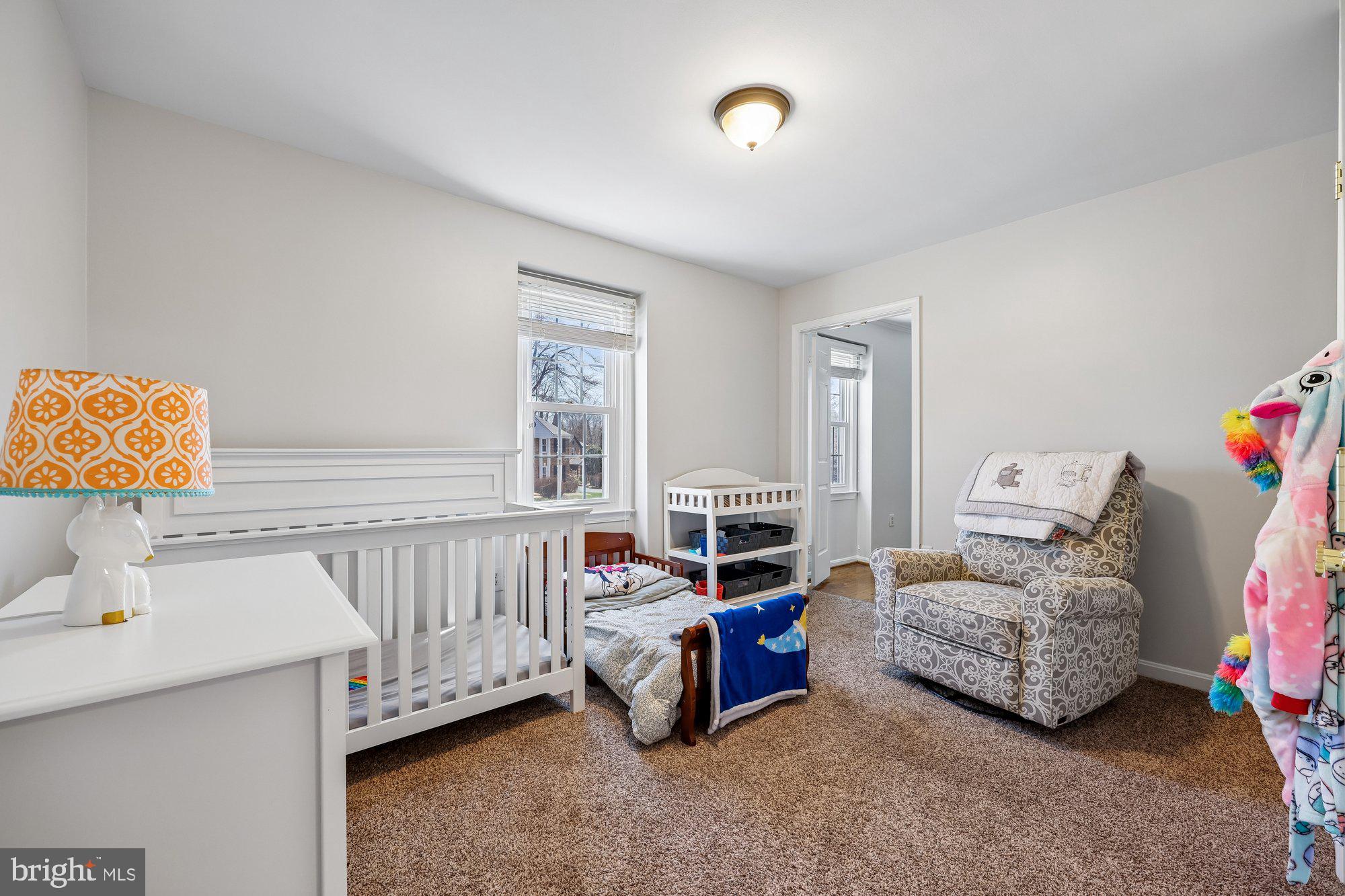 18 Kaywood Court Silver Spring, MD 20905 - Photo 48 of 71 a living room with furniture and a baby crib