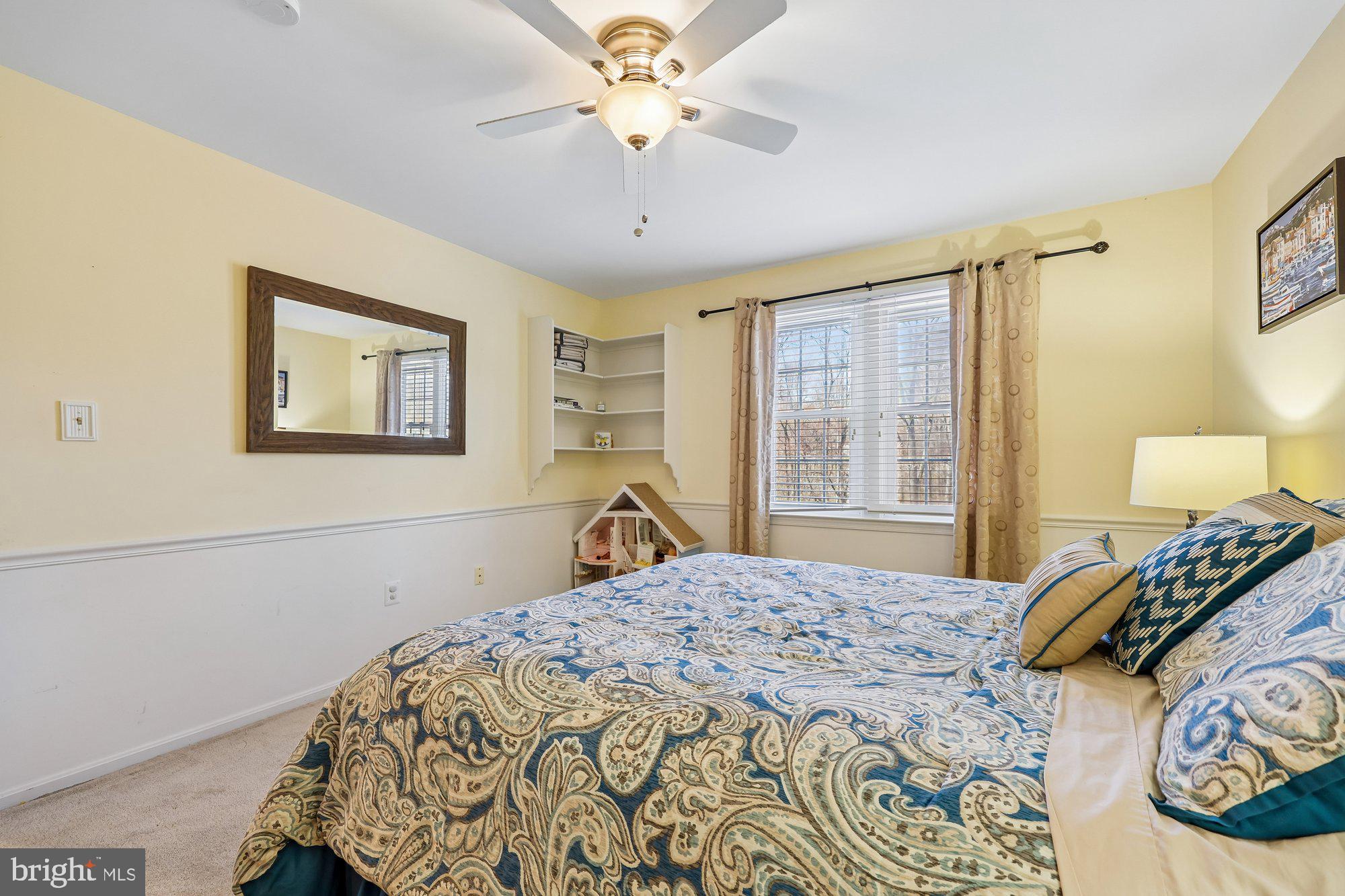 18 Kaywood Court Silver Spring, MD 20905 - Photo 56 of 71 a bedroom with a large bed and a chandelier