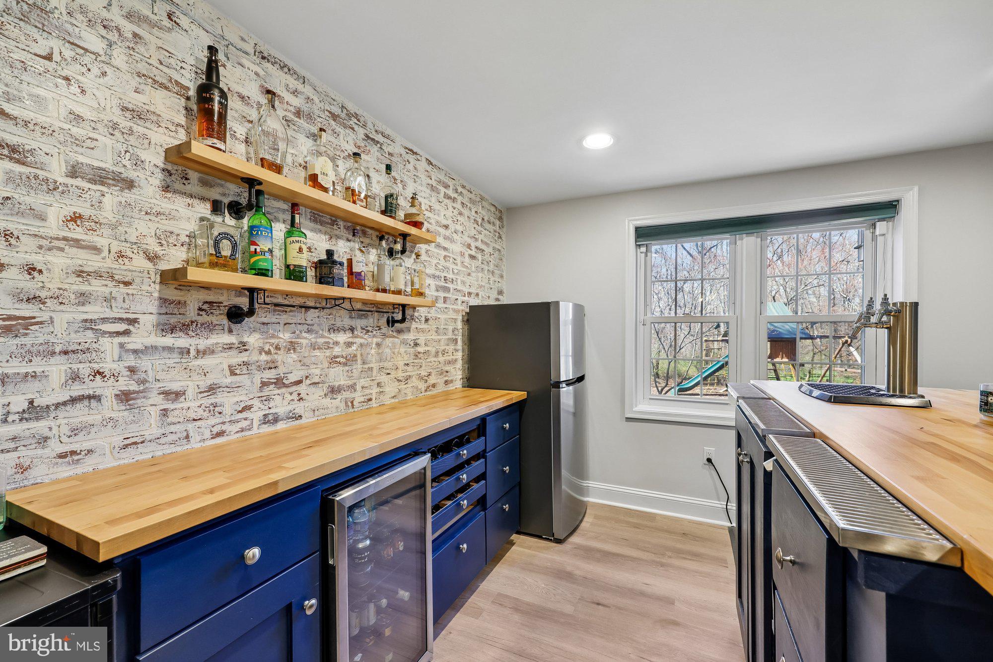 18 Kaywood Court Silver Spring, MD 20905 - Photo 61 of 71 a kitchen with a sink and a refrigerator