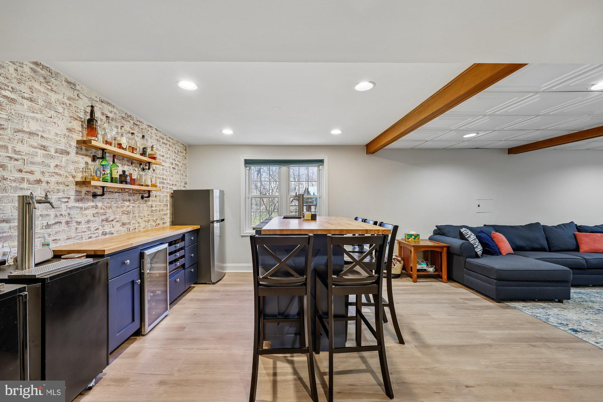 18 Kaywood Court Silver Spring, MD 20905 - Photo 63 of 71 a kitchen with stainless steel appliances granite countertop a table chairs sink and cabinets