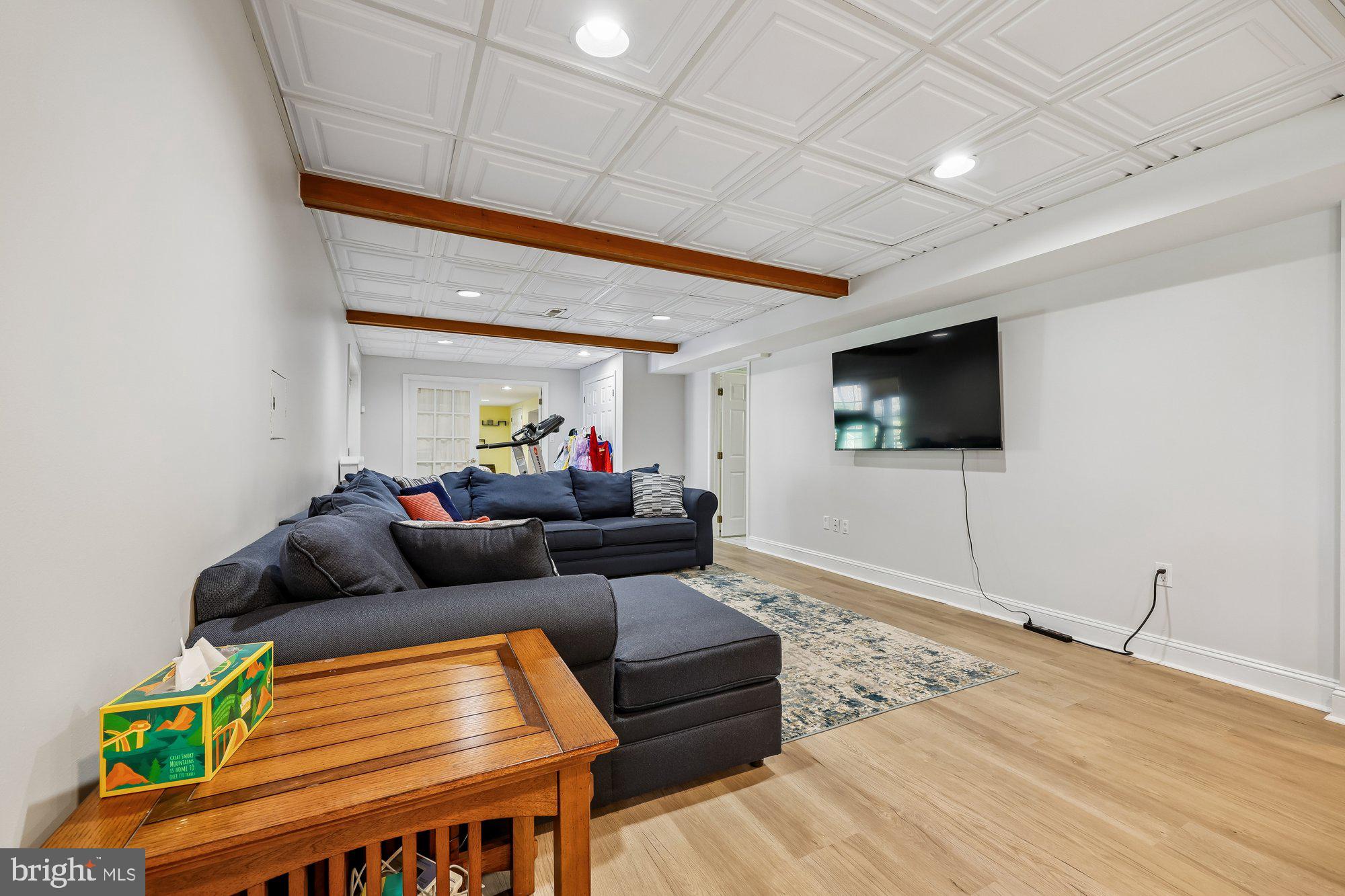 18 Kaywood Court Silver Spring, MD 20905 - Photo 65 of 71 a living room with furniture and a flat screen tv
