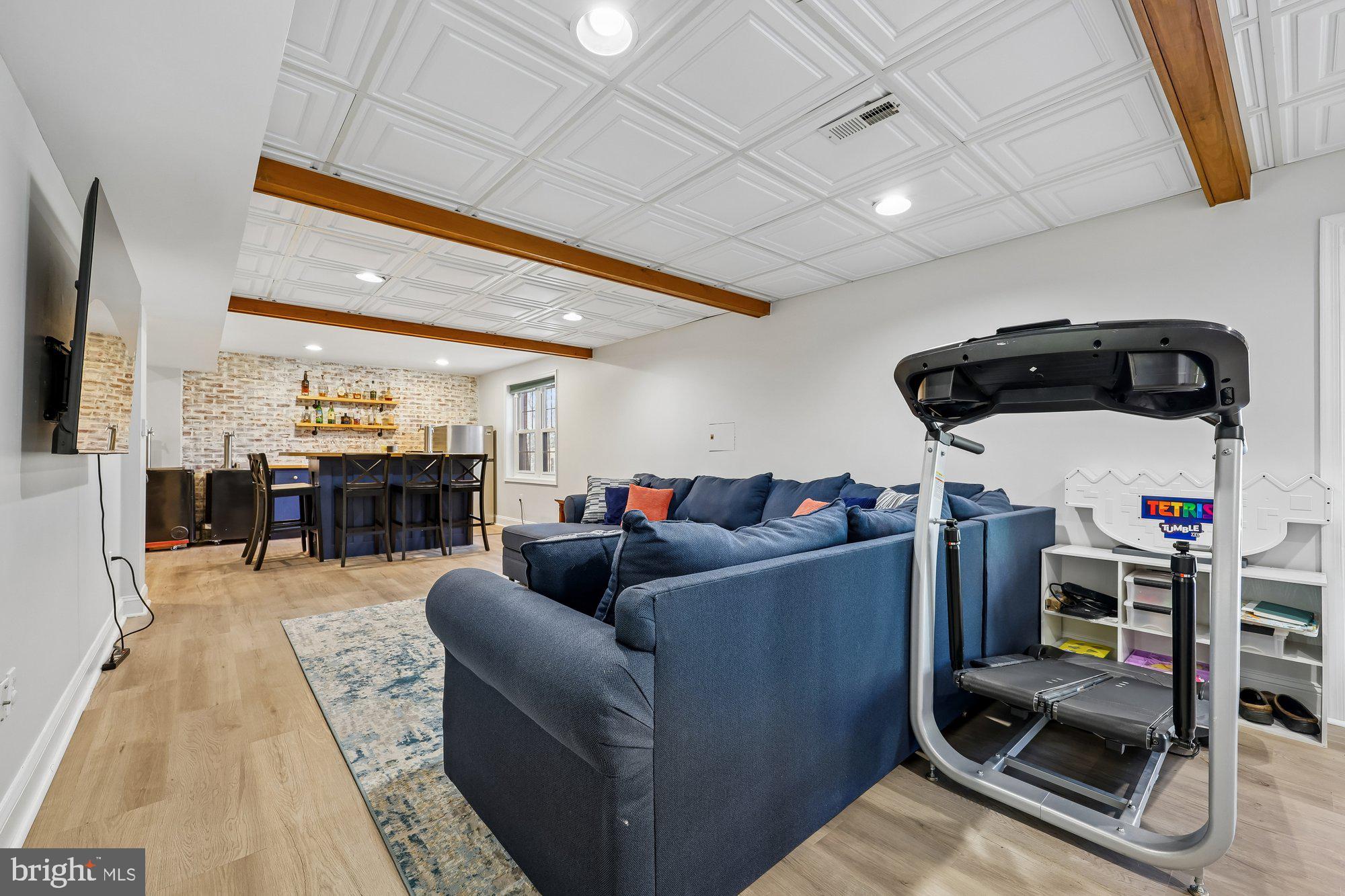 18 Kaywood Court Silver Spring, MD 20905 - Photo 66 of 71 a living room with furniture and a flat screen tv