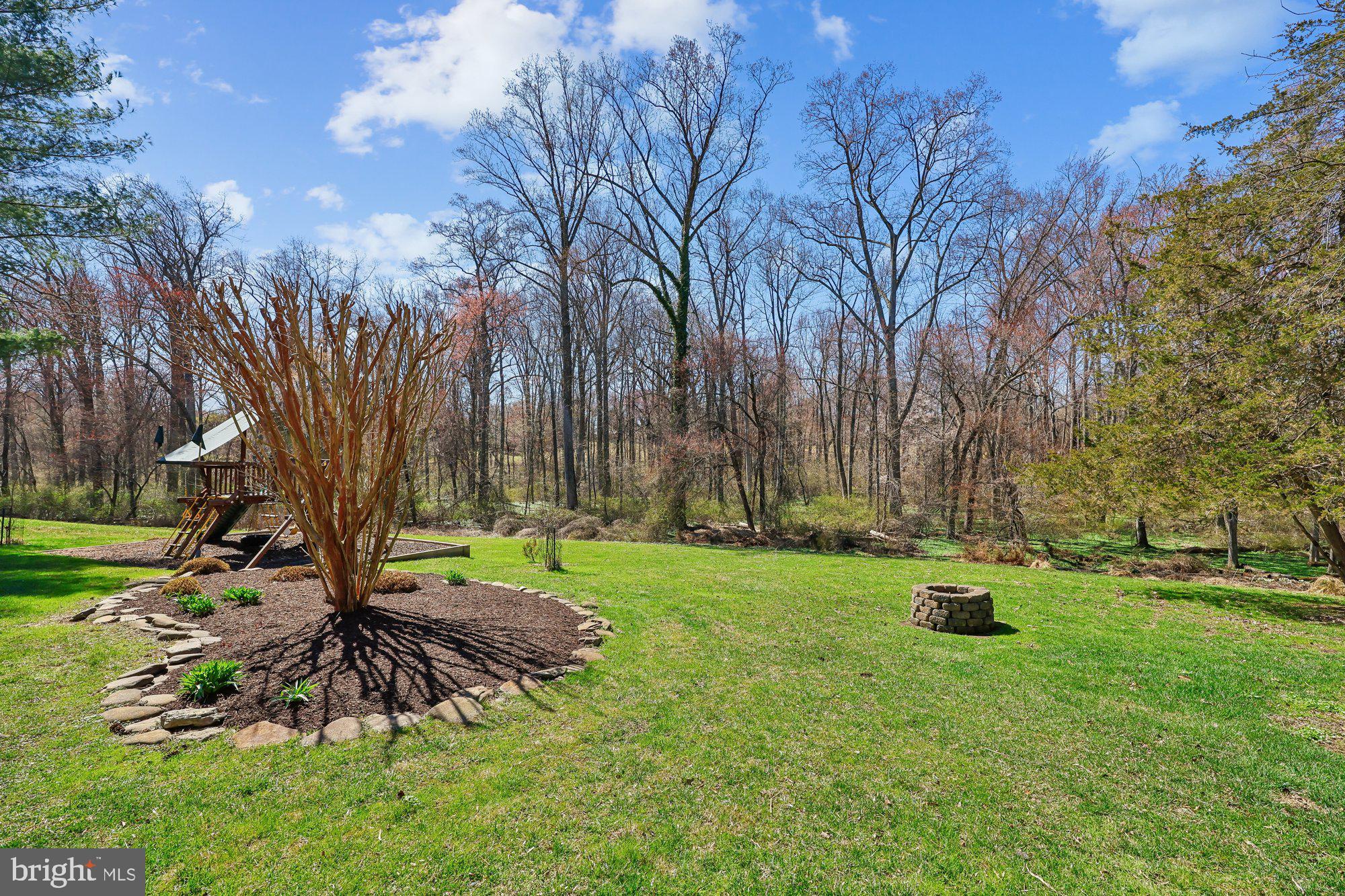 18 Kaywood Court Silver Spring, MD 20905 - Photo 10 of 71 a view of backyard with table and chairs and large trees