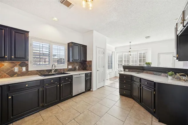 a large kitchen with cabinets