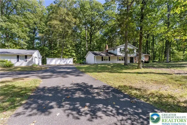 a view of a livingroom with furniture and staircase