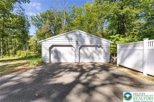 a view of an empty room with glass door and balcony