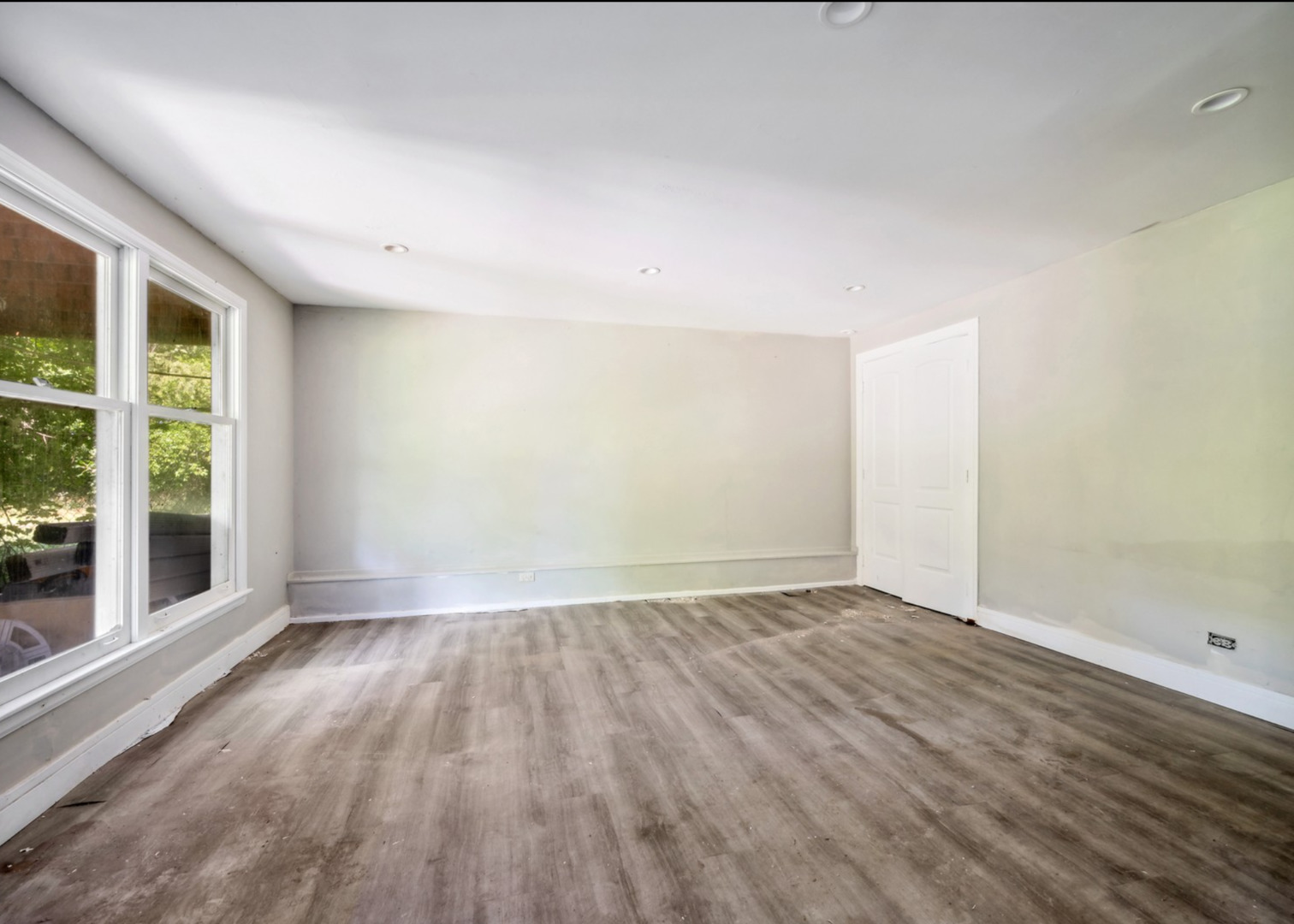 5N030 Ridge Lane Wayne, IL 60184 - Photo 13 of 21 a view of an empty room with wooden floor and a window
