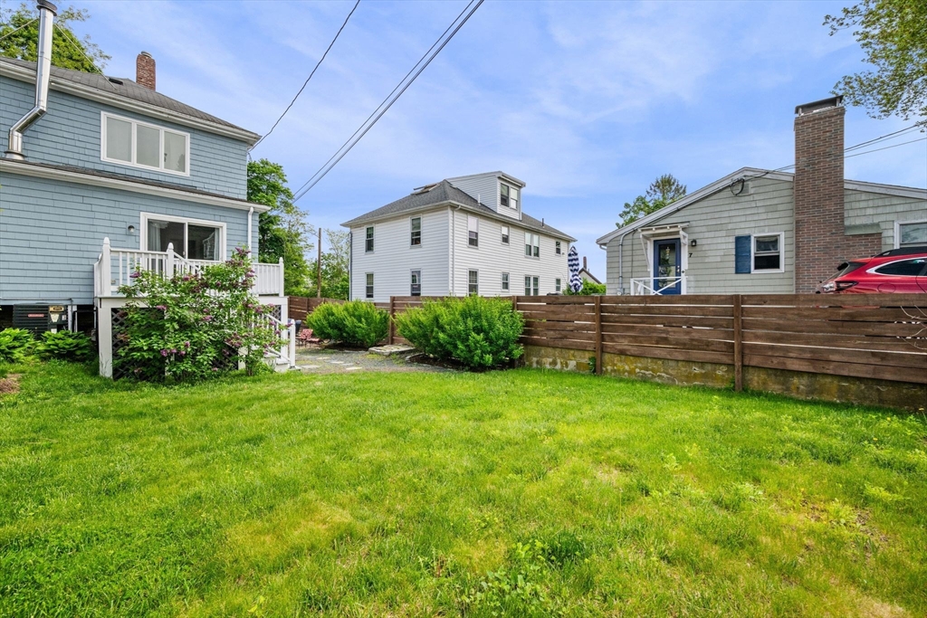 8 Baker Avenue Beverly, MA 01915 - Photo 34 of 40 a view of a house with a back yard
