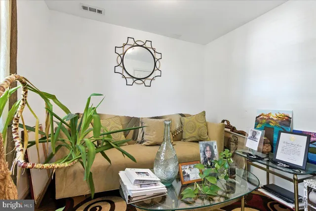 a kitchen with granite countertop a sink a stove and refrigerator
