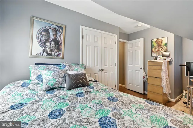 a view of walk in closet with clothes