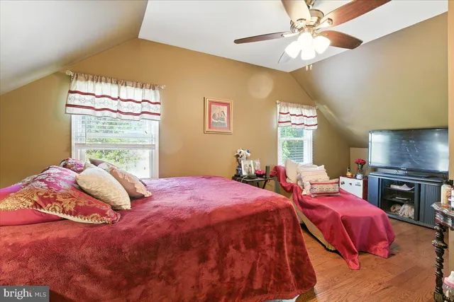 a bed room with a bed and a window