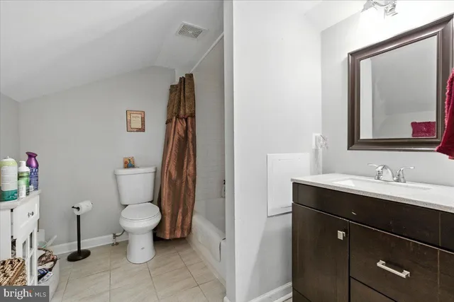 a bathroom with a shower and a sink