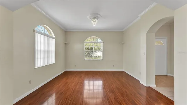 a bathroom with a granite countertop toilet a sink and a mirror