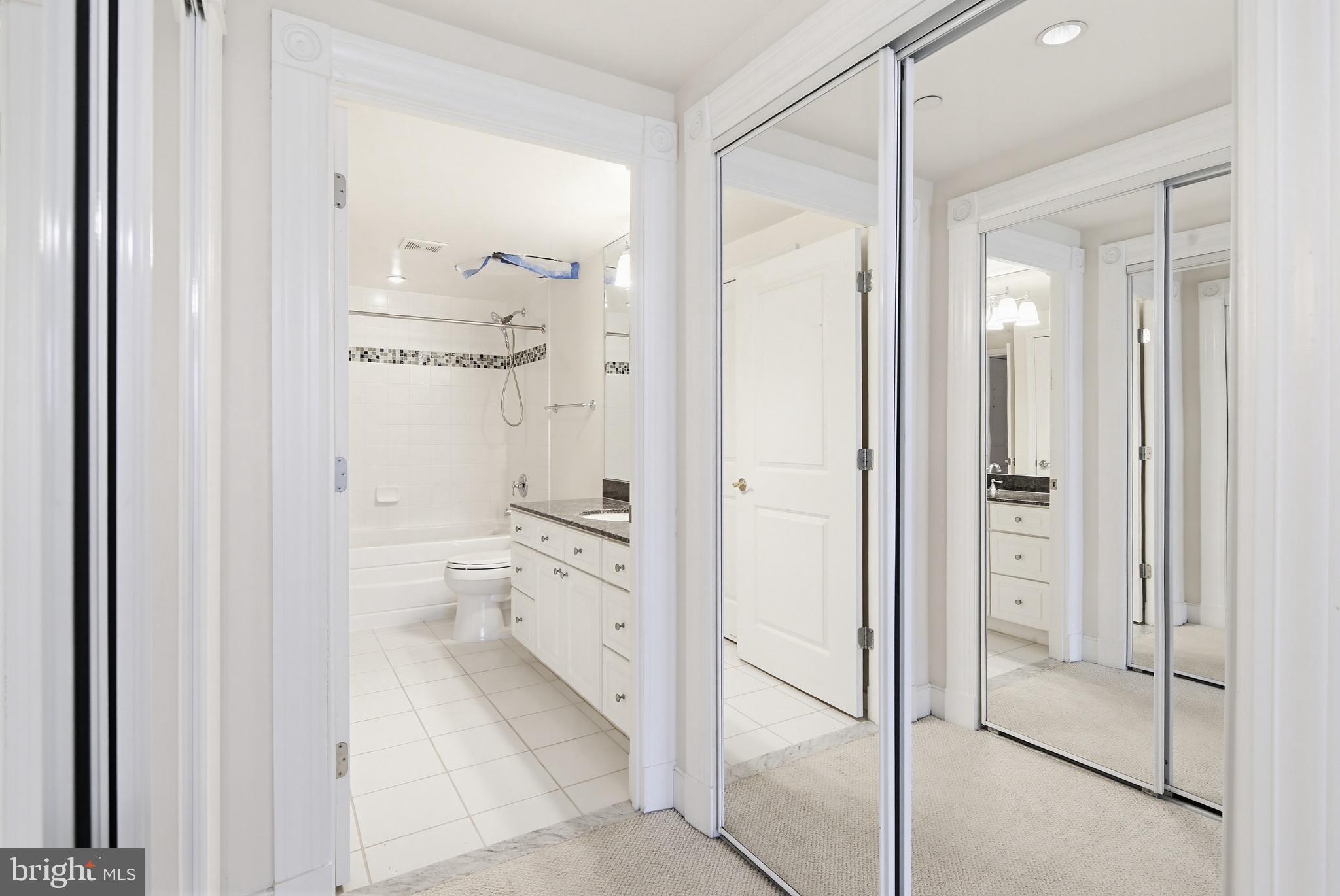 5 Park Place, Unit 425 Annapolis, MD 21401 - Photo 11 of 28 a bathroom with a granite countertop shower mirror and toilet