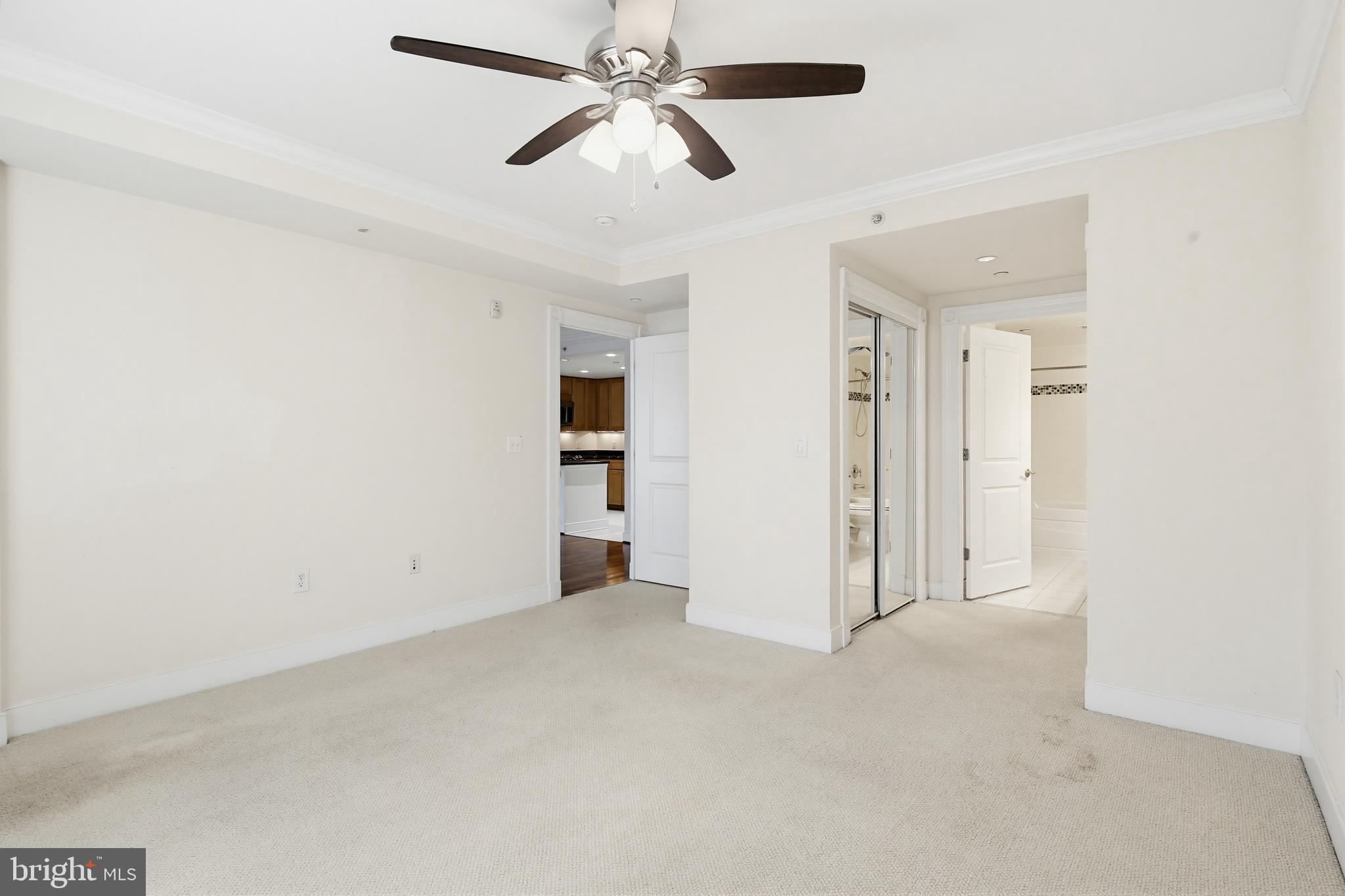 5 Park Place, Unit 425 Annapolis, MD 21401 - Photo 13 of 28 an empty room with closet and a ceiling fan