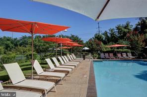 5 Park Place, Unit 425 Annapolis, MD 21401 - Photo 26 of 28 a view of a swimming pool with lounge chairs in patio