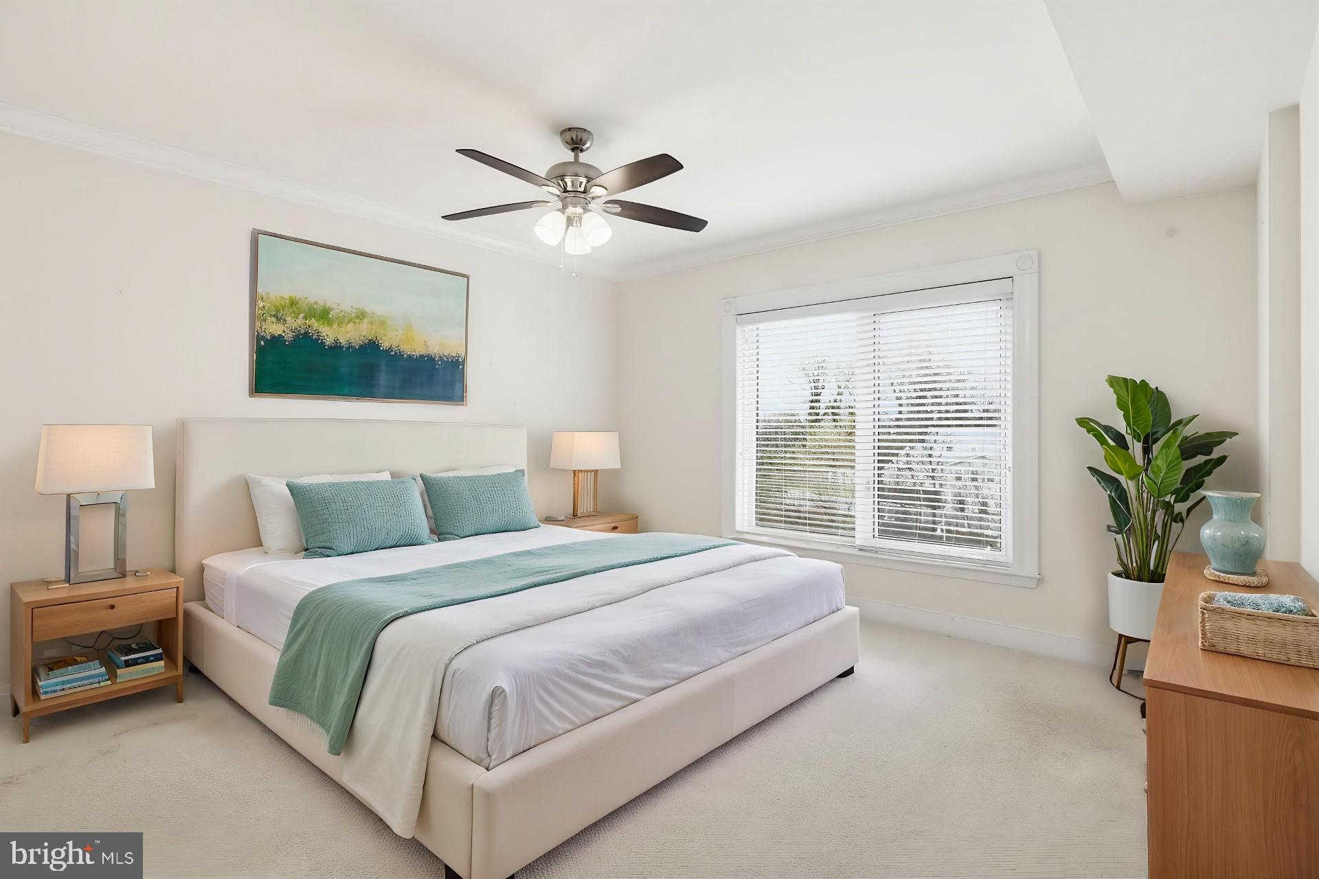 5 Park Place, Unit 425 Annapolis, MD 21401 - Photo 4 of 28 a bedroom with a large bed and a window