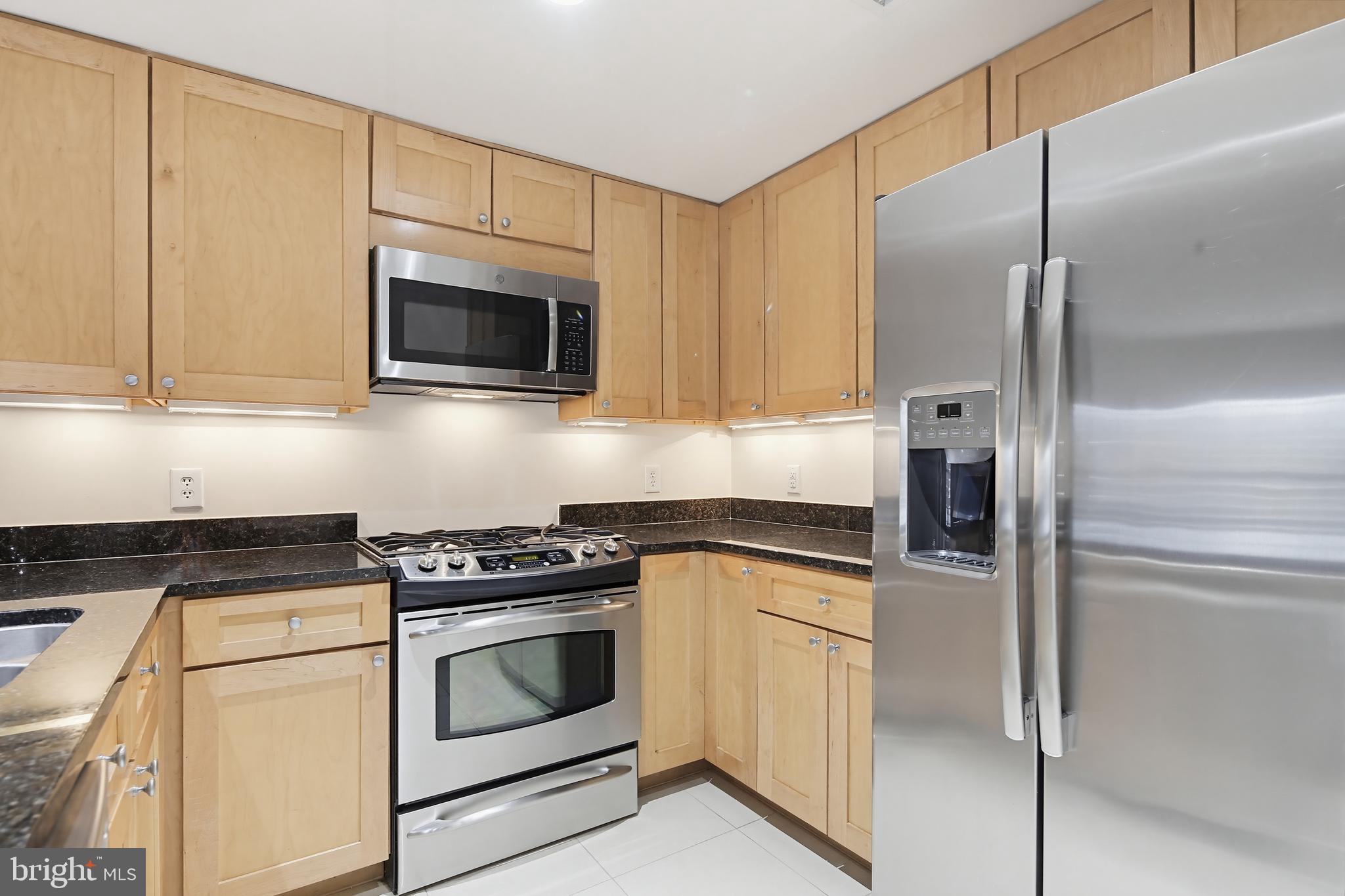 5 Park Place, Unit 425 Annapolis, MD 21401 - Photo 7 of 28 a kitchen with cabinets stainless steel appliances and a counter space