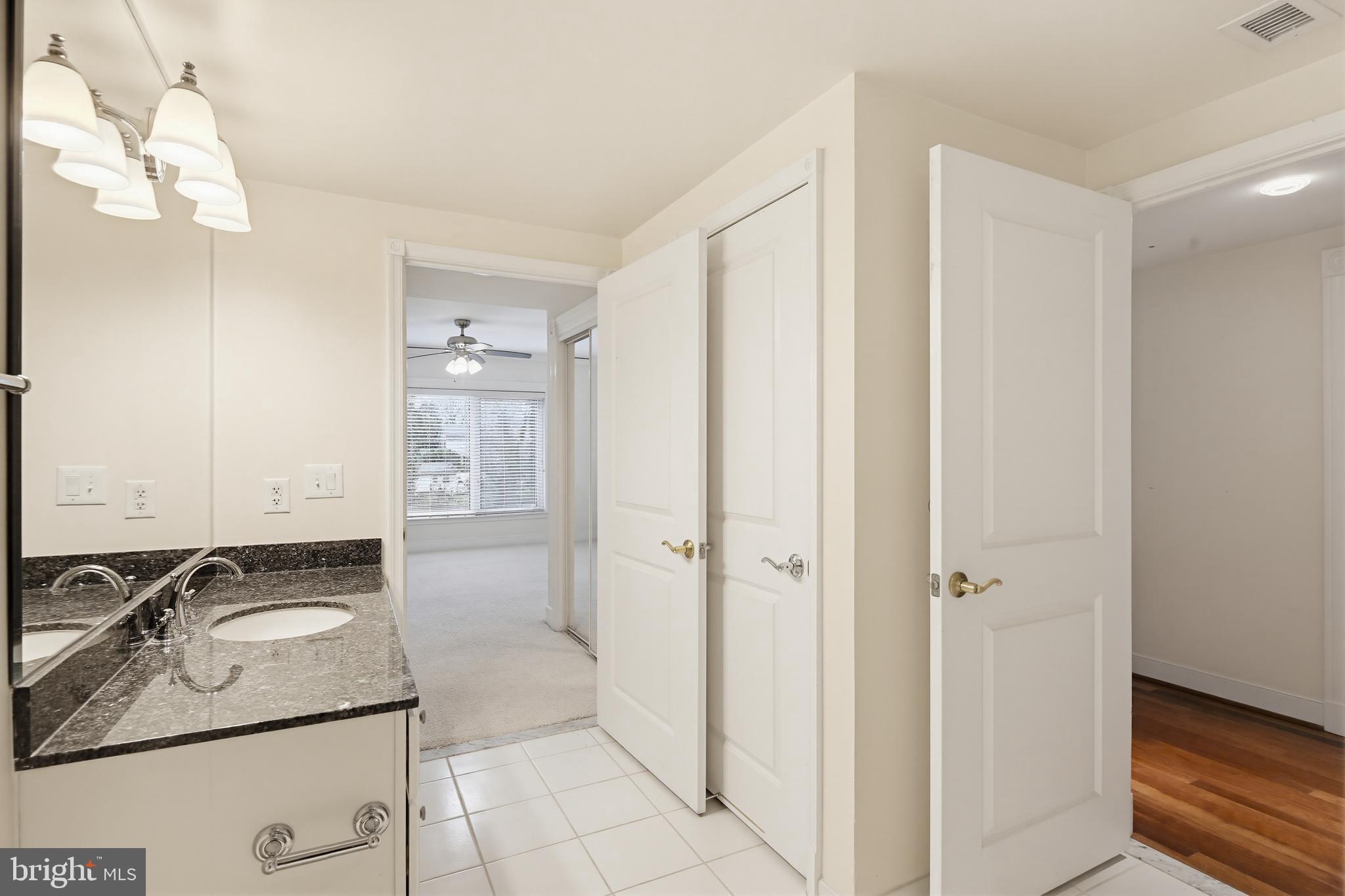 5 Park Place, Unit 425 Annapolis, MD 21401 - Photo 10 of 28 a bathroom with a sink and a mirror