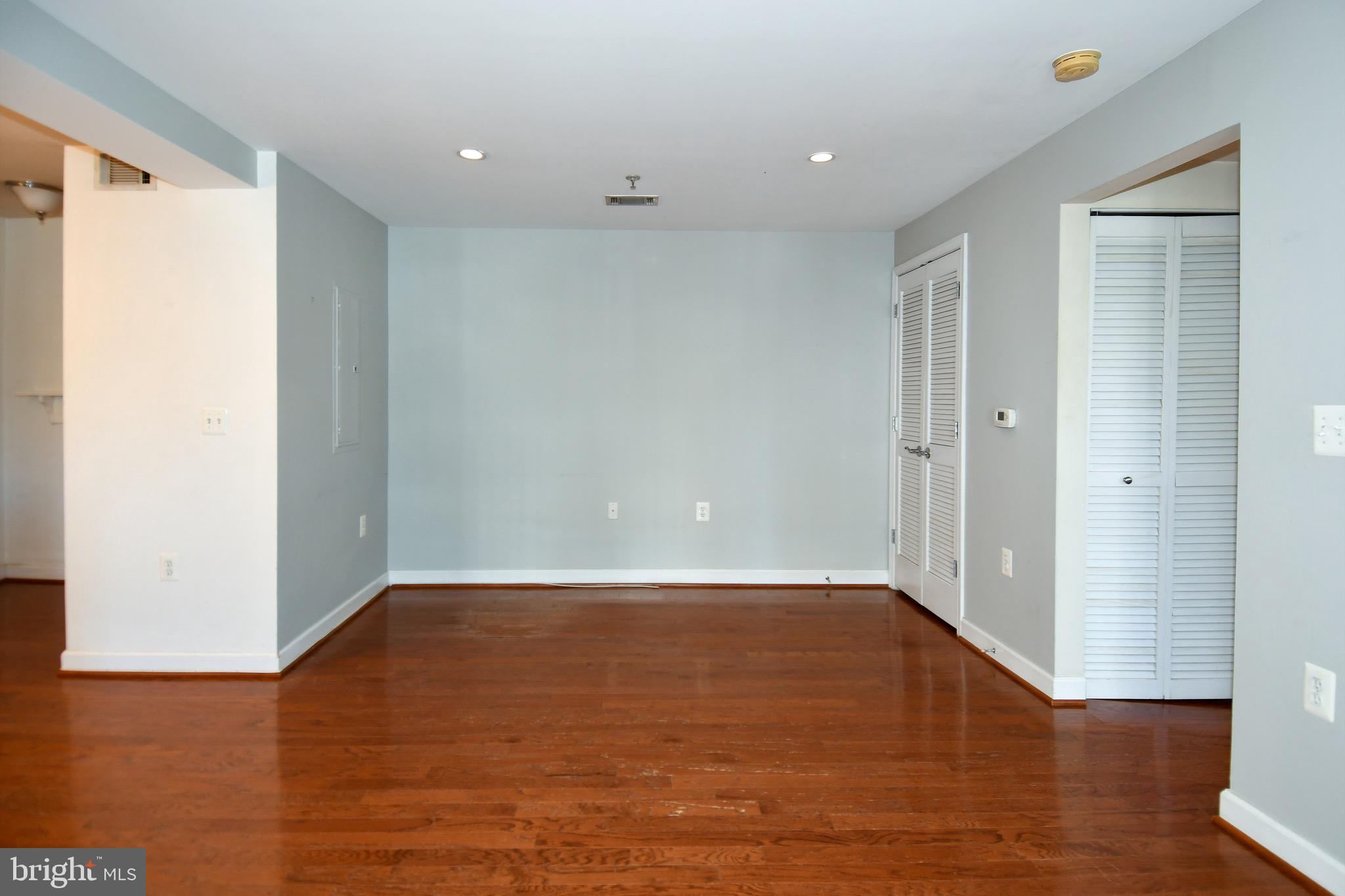 4127 South Four Mile Run Drive, Unit 304 Arlington, VA 22204 - Photo 15 of 44 a view of a room with wooden floor