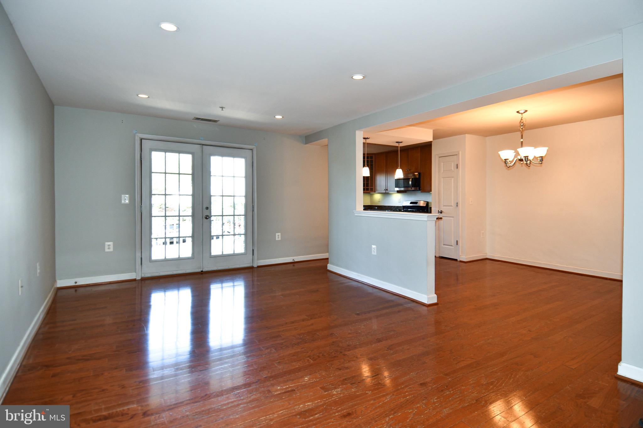4127 South Four Mile Run Drive, Unit 304 Arlington, VA 22204 - Photo 17 of 44 wooden floor in an empty room with a window
