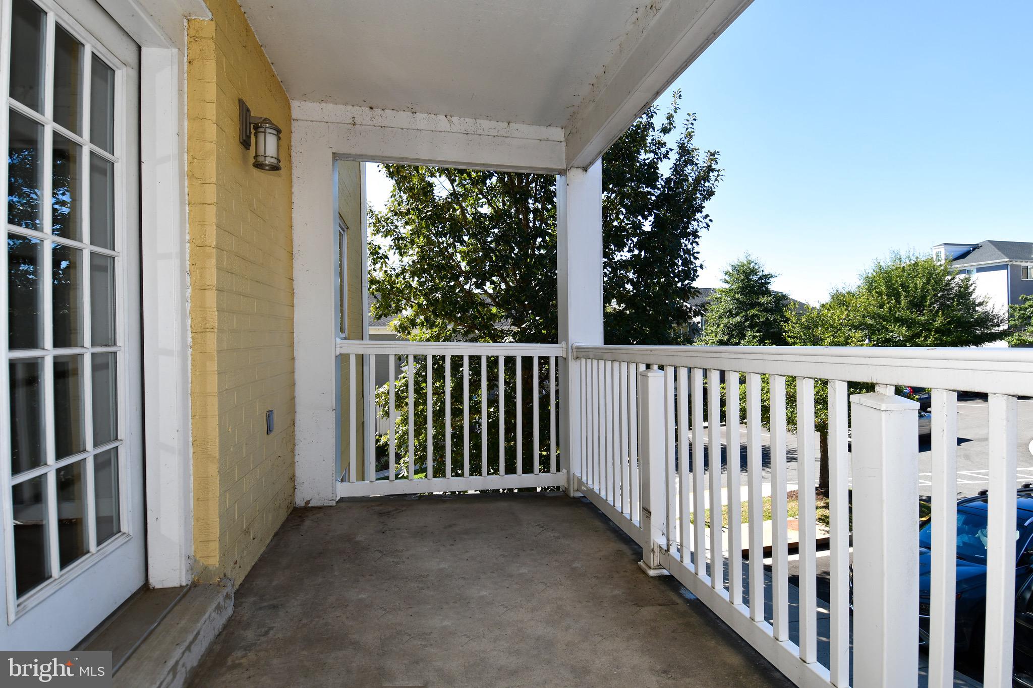 4127 South Four Mile Run Drive, Unit 304 Arlington, VA 22204 - Photo 19 of 44 a view of a balcony with tree