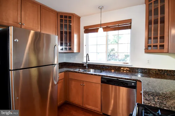 a white refrigerator freezer sitting inside of a kitchen