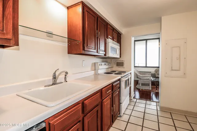 a kitchen with a sink and cabinets