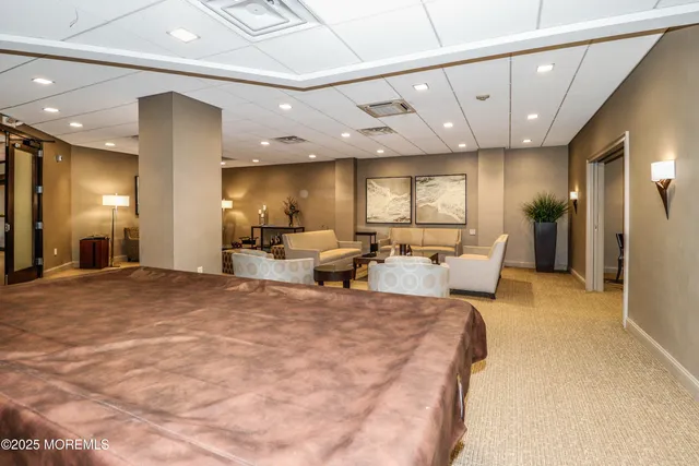 a large hall with a large mirror and furniture