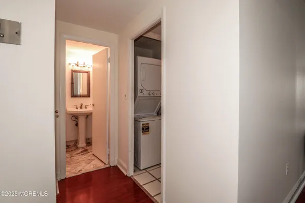 a white toilet sitting next to a shower curtain