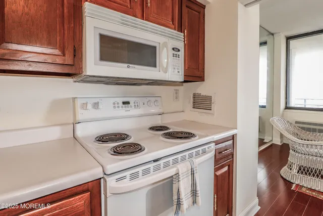 a kitchen with a stove and a microwave