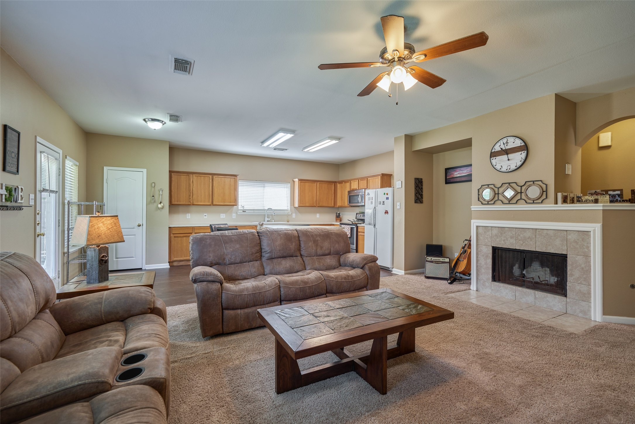 6214 Channelbrook Lane Spring, TX 77379 - Photo 12 of 29 a living room with furniture and a fireplace