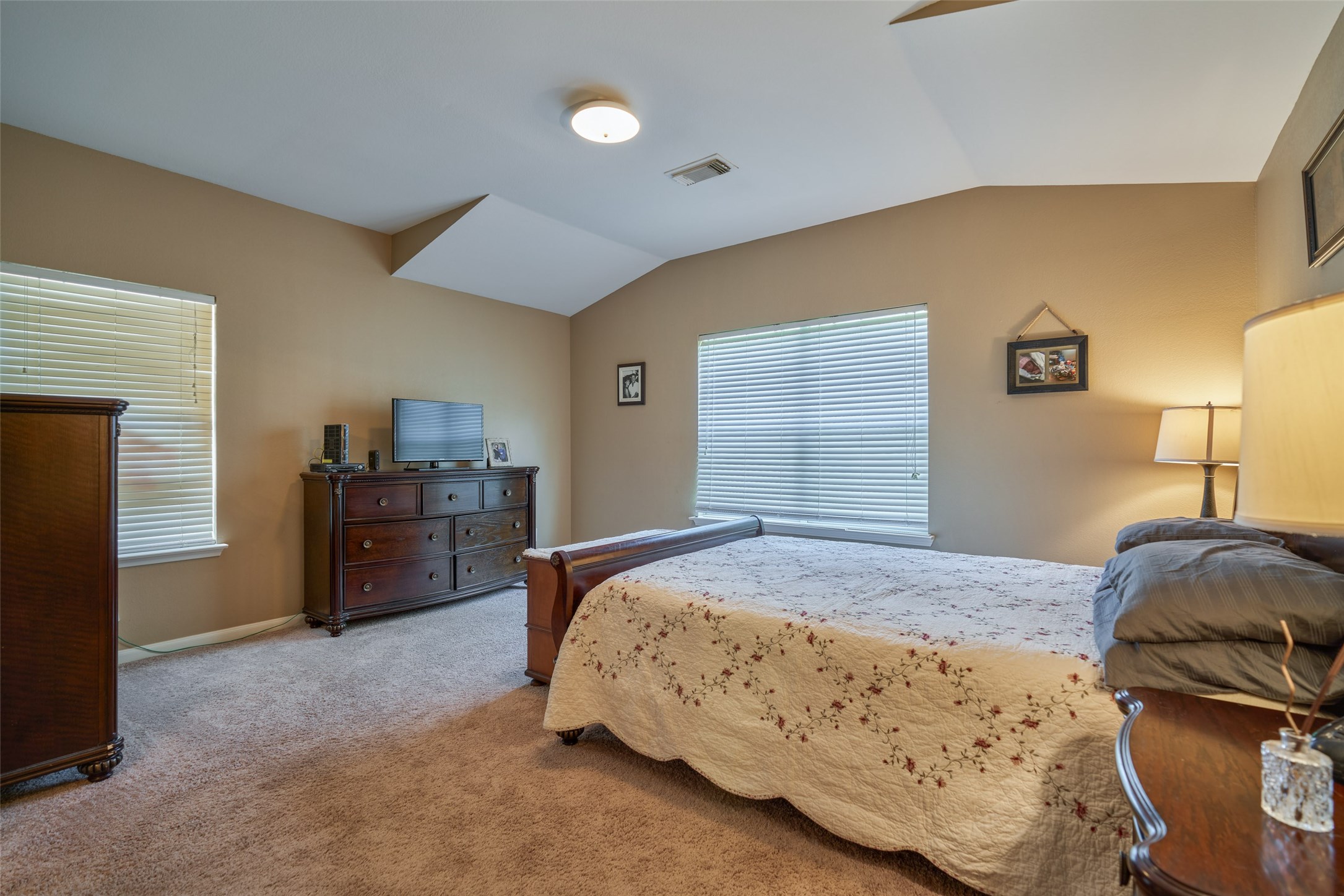 6214 Channelbrook Lane Spring, TX 77379 - Photo 18 of 29 a bedroom with a bed and a lamp