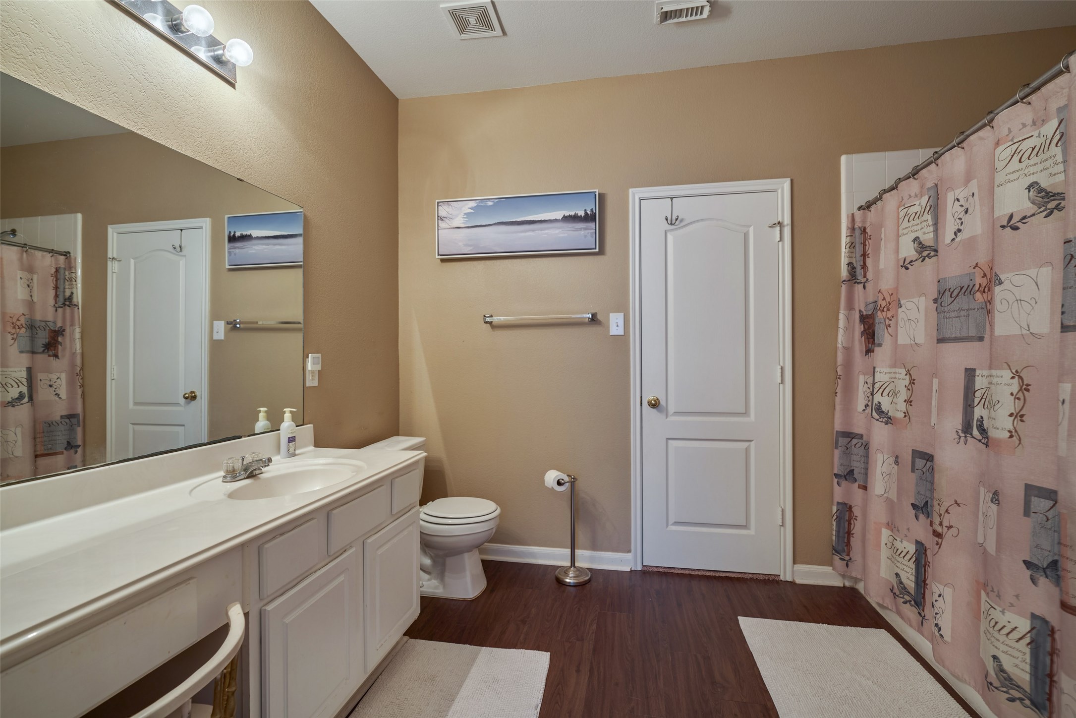 6214 Channelbrook Lane Spring, TX 77379 - Photo 19 of 29 a bathroom with a sink a toilet and shower