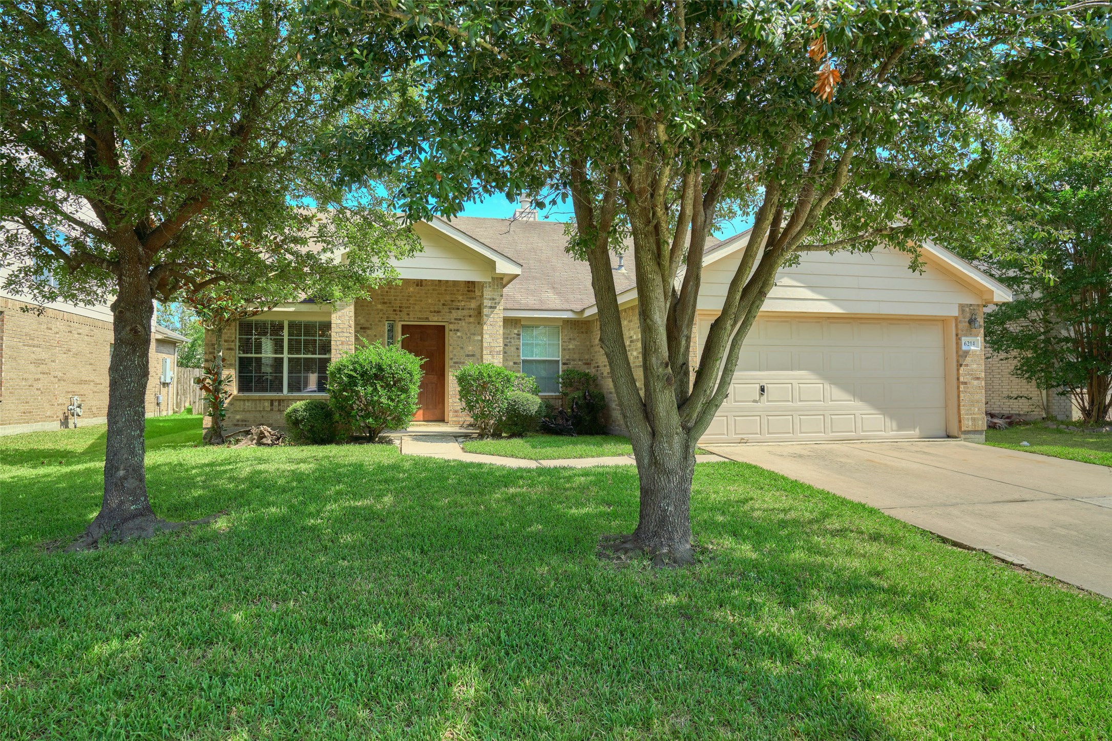 6214 Channelbrook Lane Spring, TX 77379 - Photo 2 of 29 a front view of a house with garden