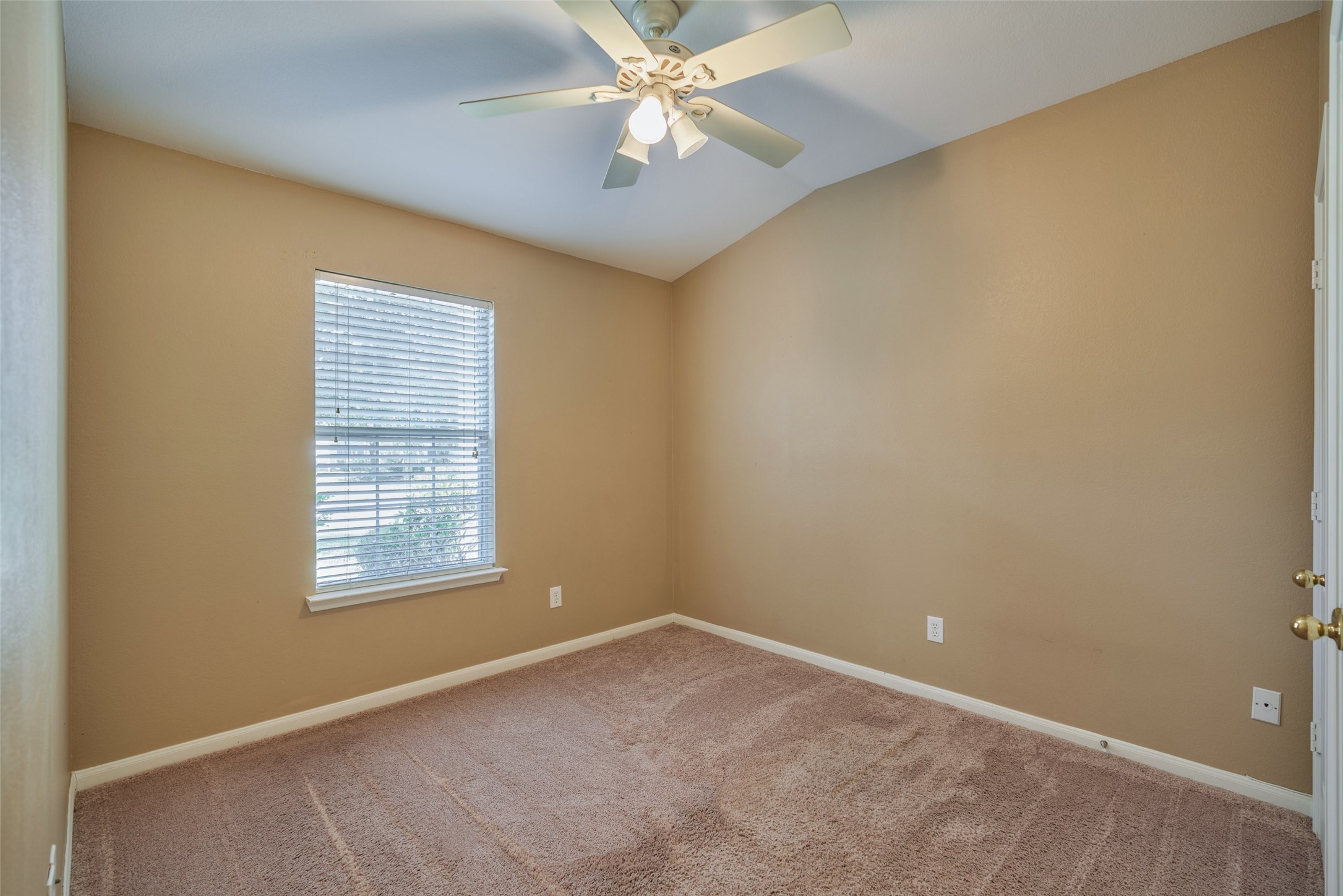 6214 Channelbrook Lane Spring, TX 77379 - Photo 21 of 29 an empty room with a window and a fan