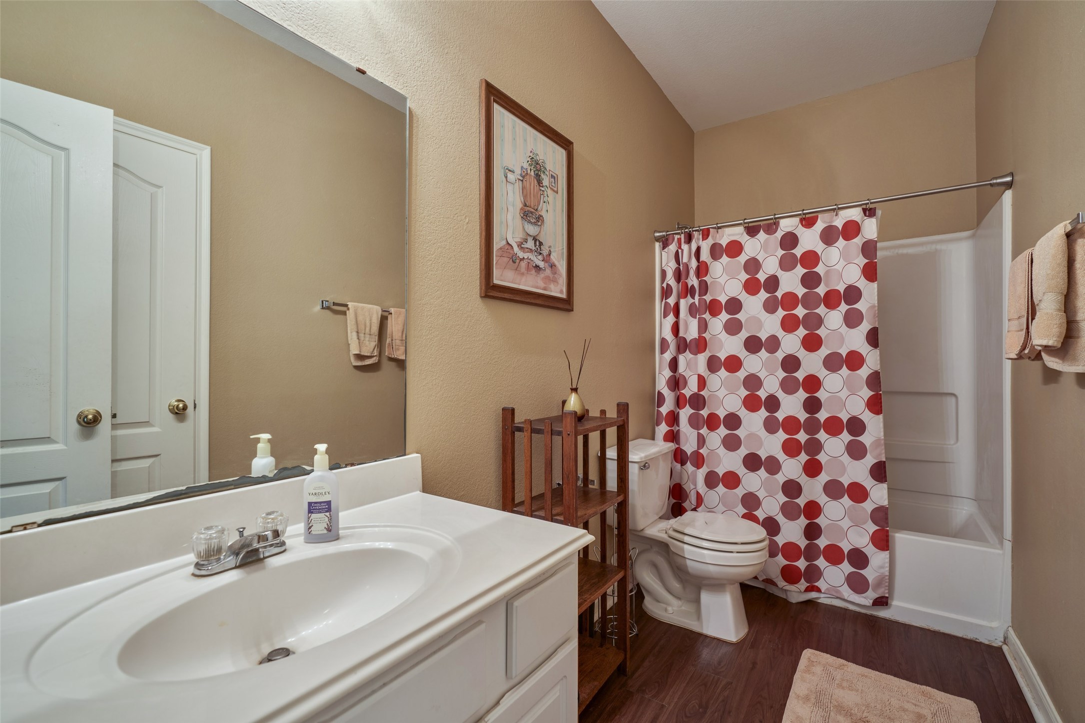 6214 Channelbrook Lane Spring, TX 77379 - Photo 23 of 29 a bathroom with a sink toilet and shower
