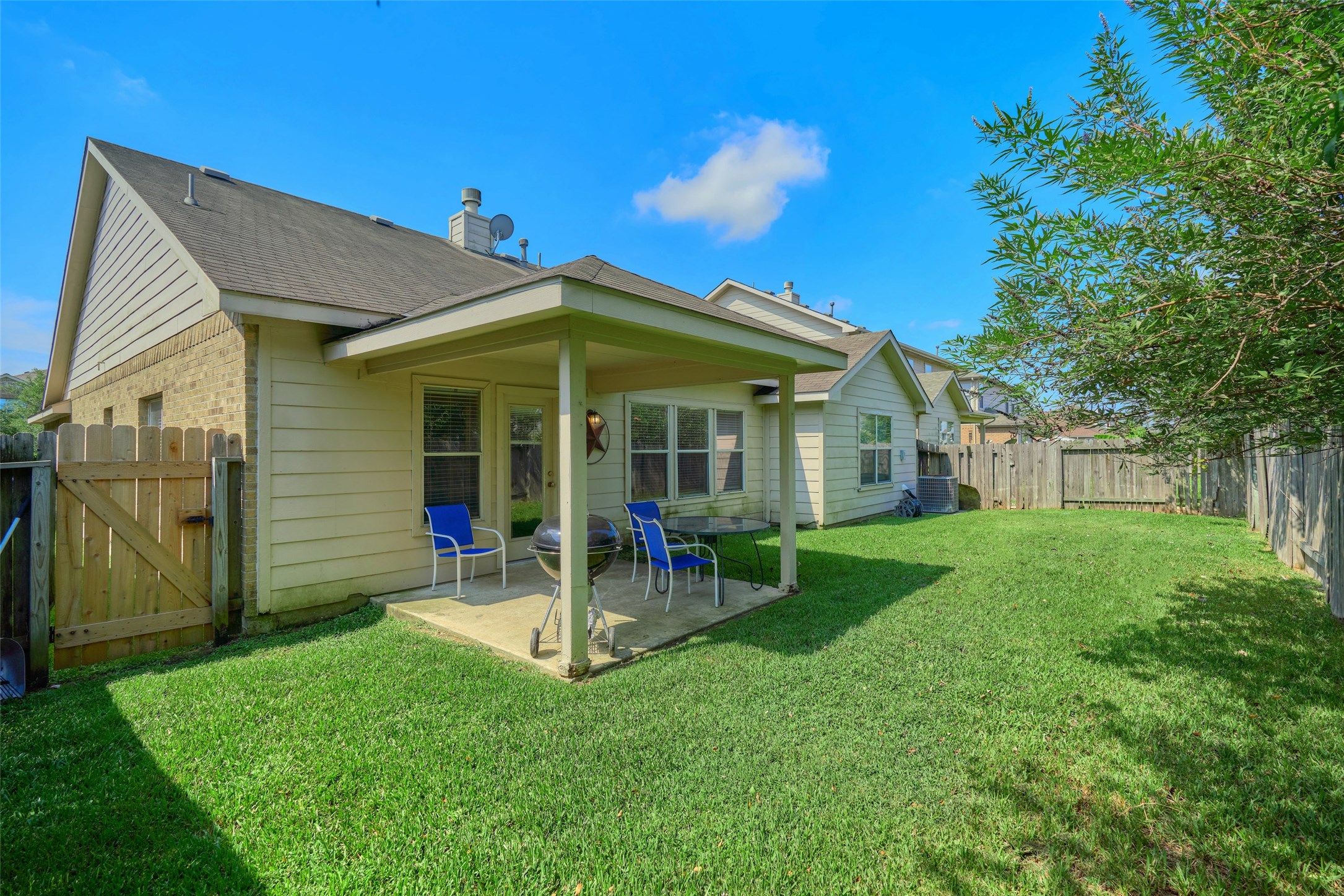 6214 Channelbrook Lane Spring, TX 77379 - Photo 28 of 29 a view of a house with a yard and sitting area