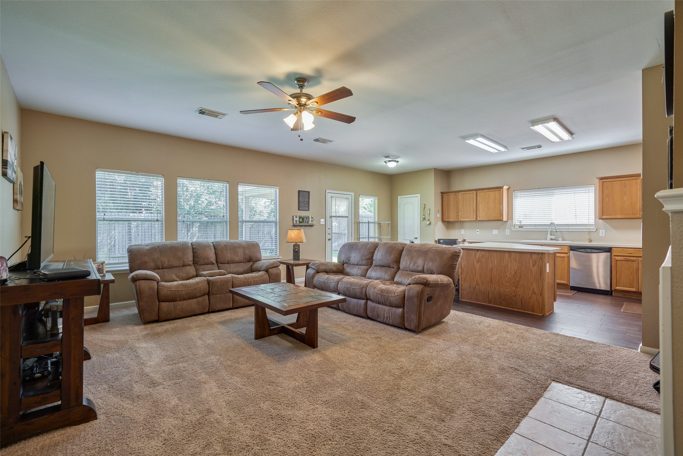 6214 Channelbrook Lane Spring, TX 77379 - Photo 9 of 29 a living room with furniture and a flat screen tv