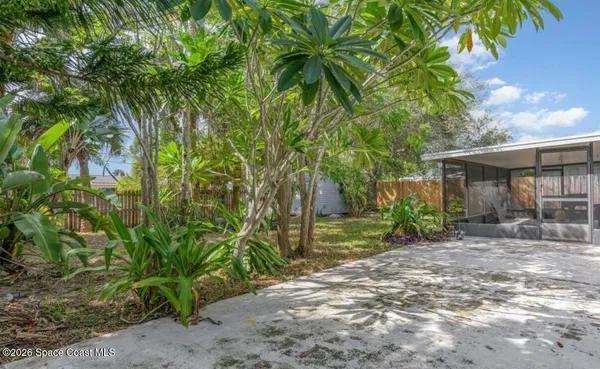 a view of a house with a tree in the background