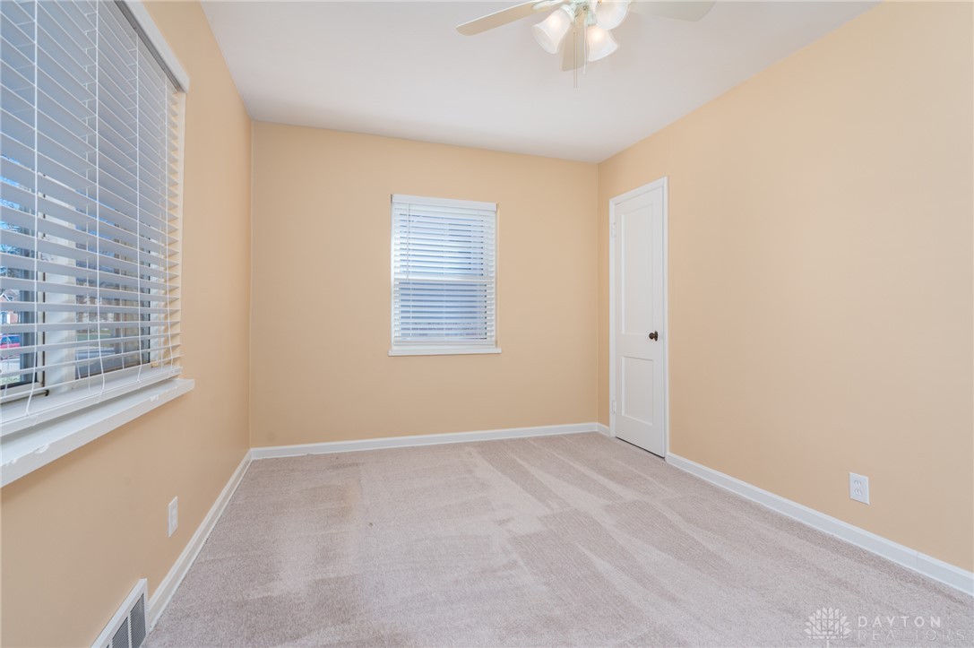 326 North Bromfield Road Kettering, OH 45429 - Photo 14 of 30 This airy bedroom features light walls, carpet flooring, and ample natural light, creating a serene retreat.