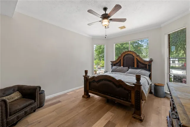 a bedroom with a bed and a couch