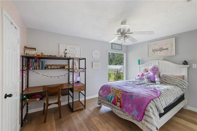 a bedroom with a bed and a table in it